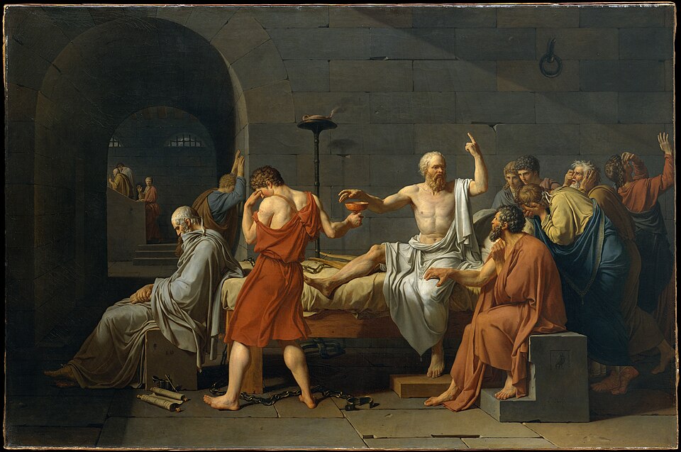 Socrate assis sur son lit tend la main vers la coupe de ciguë, entouré de disciples accablés